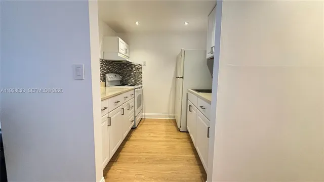 a bathroom with a double vanity sink and a large mirror