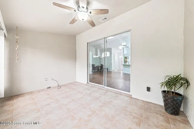 a view of an empty room and a window