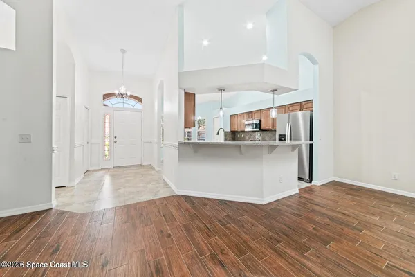 a view of a kitchen from the hallway