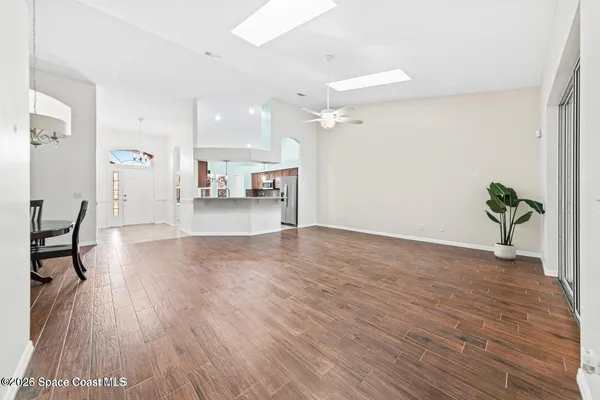 a view of a living room and hardwood floor