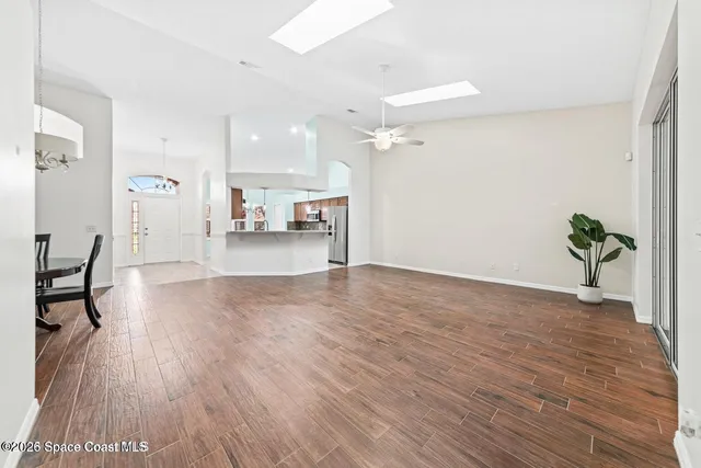 a view of a living room and hardwood floor