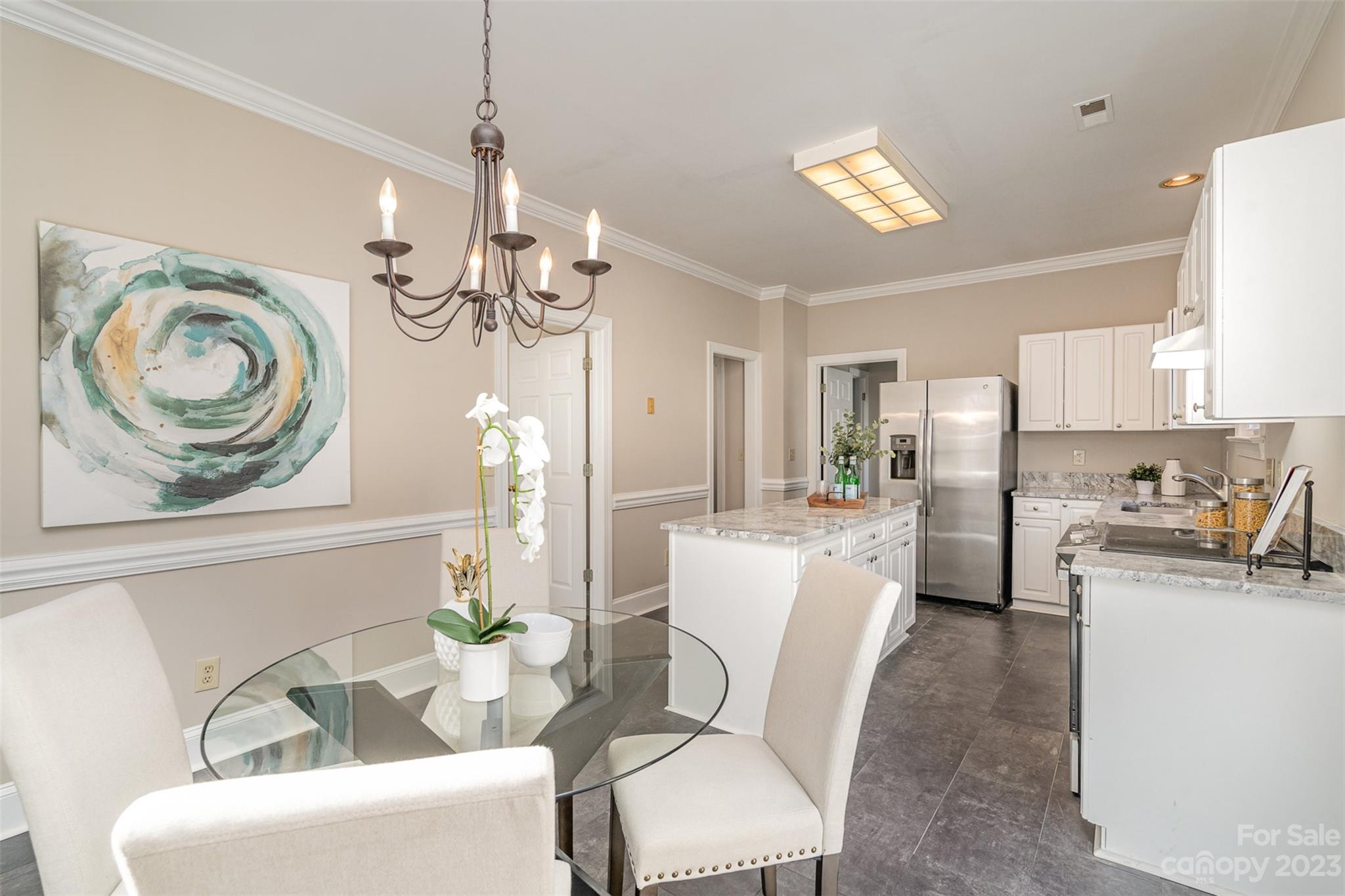 2906 Saintfield Place Charlotte, NC 28270 - Photo 13 of 37 a living room with furniture a chandelier and a mirror