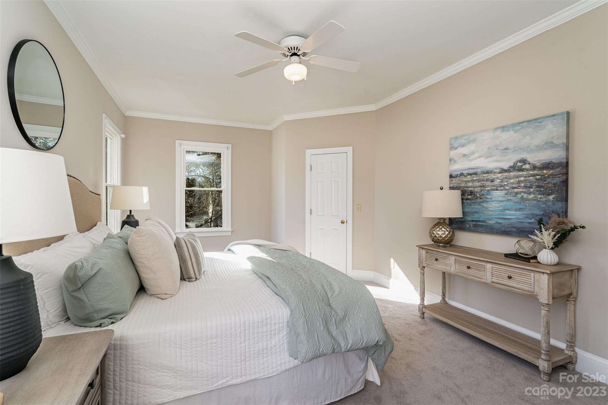2906 Saintfield Place Charlotte, NC 28270 - Photo 19 of 37 a bedroom with a bed and a chandelier