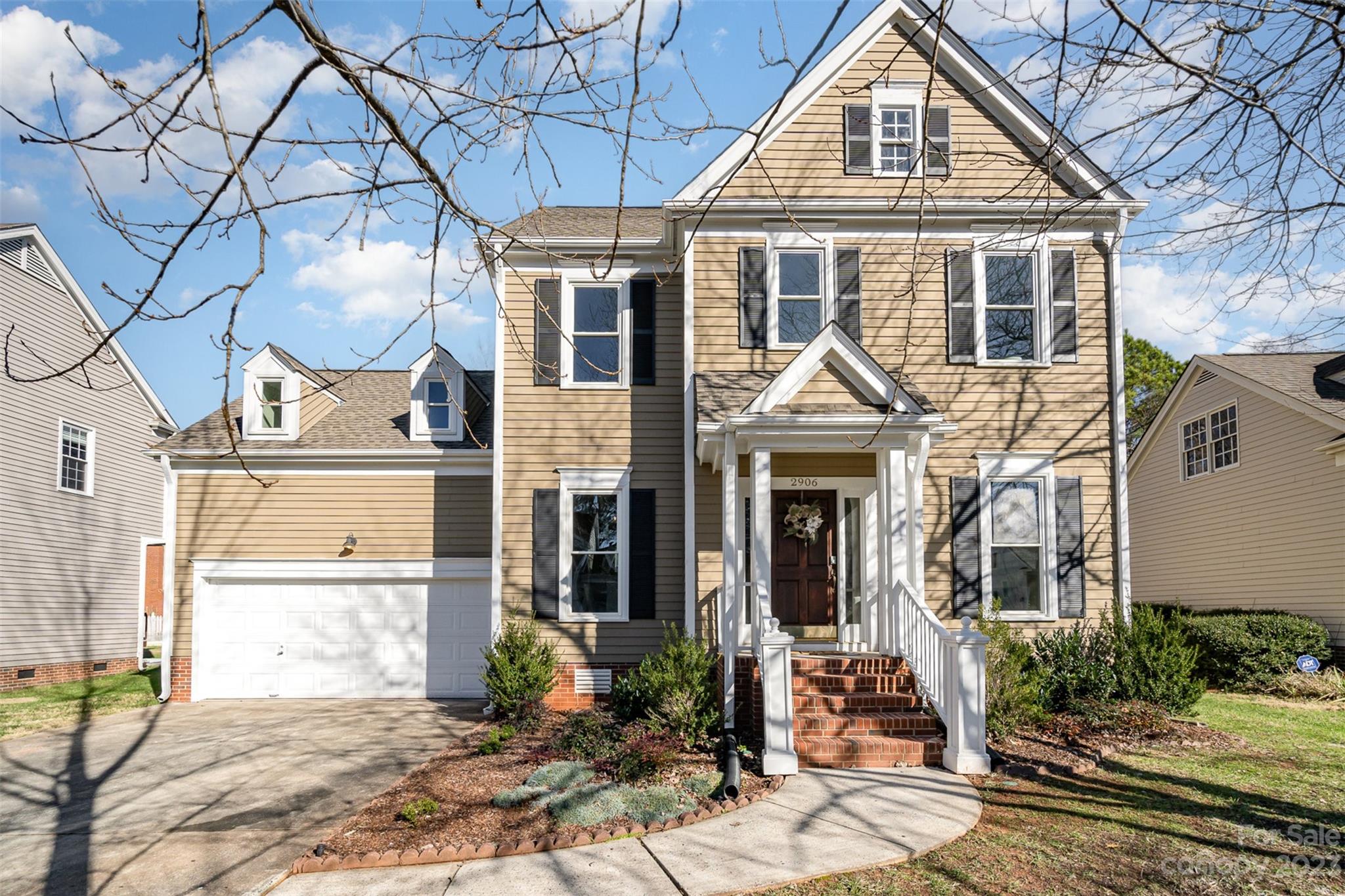 2906 Saintfield Place Charlotte, NC 28270 - Photo 2 of 37 a front view of a house with a yard