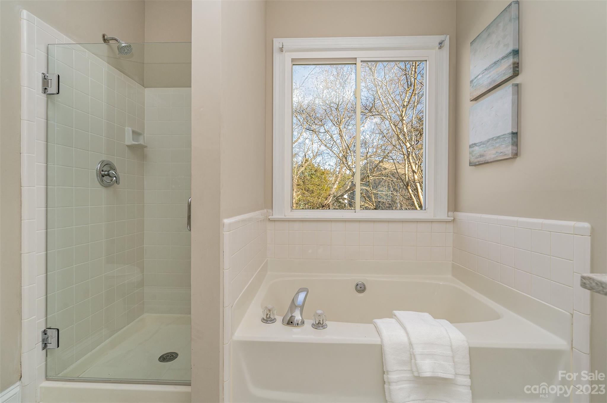 2906 Saintfield Place Charlotte, NC 28270 - Photo 22 of 37 a bathroom with a bathtub and shower