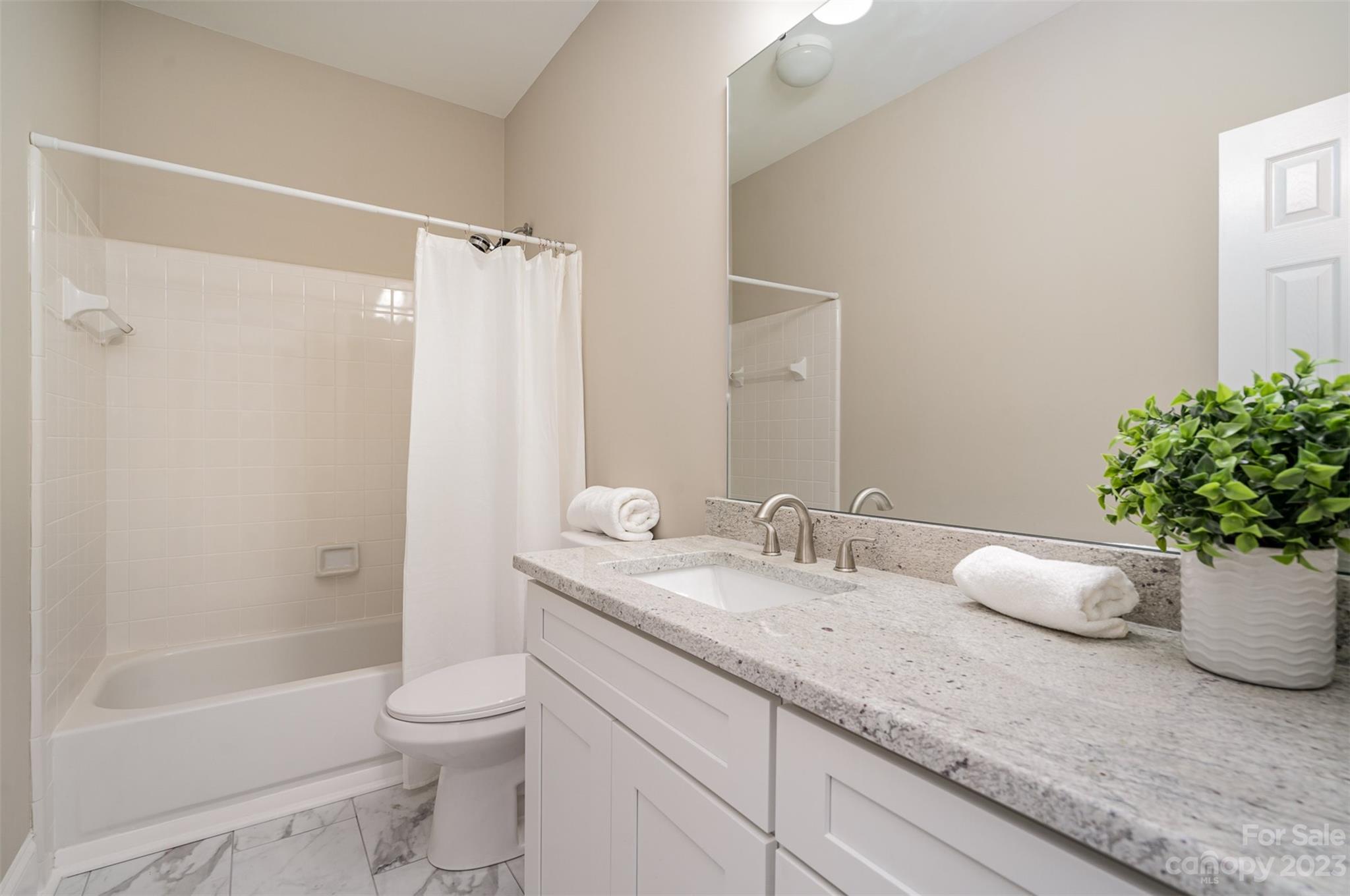 2906 Saintfield Place Charlotte, NC 28270 - Photo 25 of 37 a bathroom with a granite countertop sink a toilet and shower