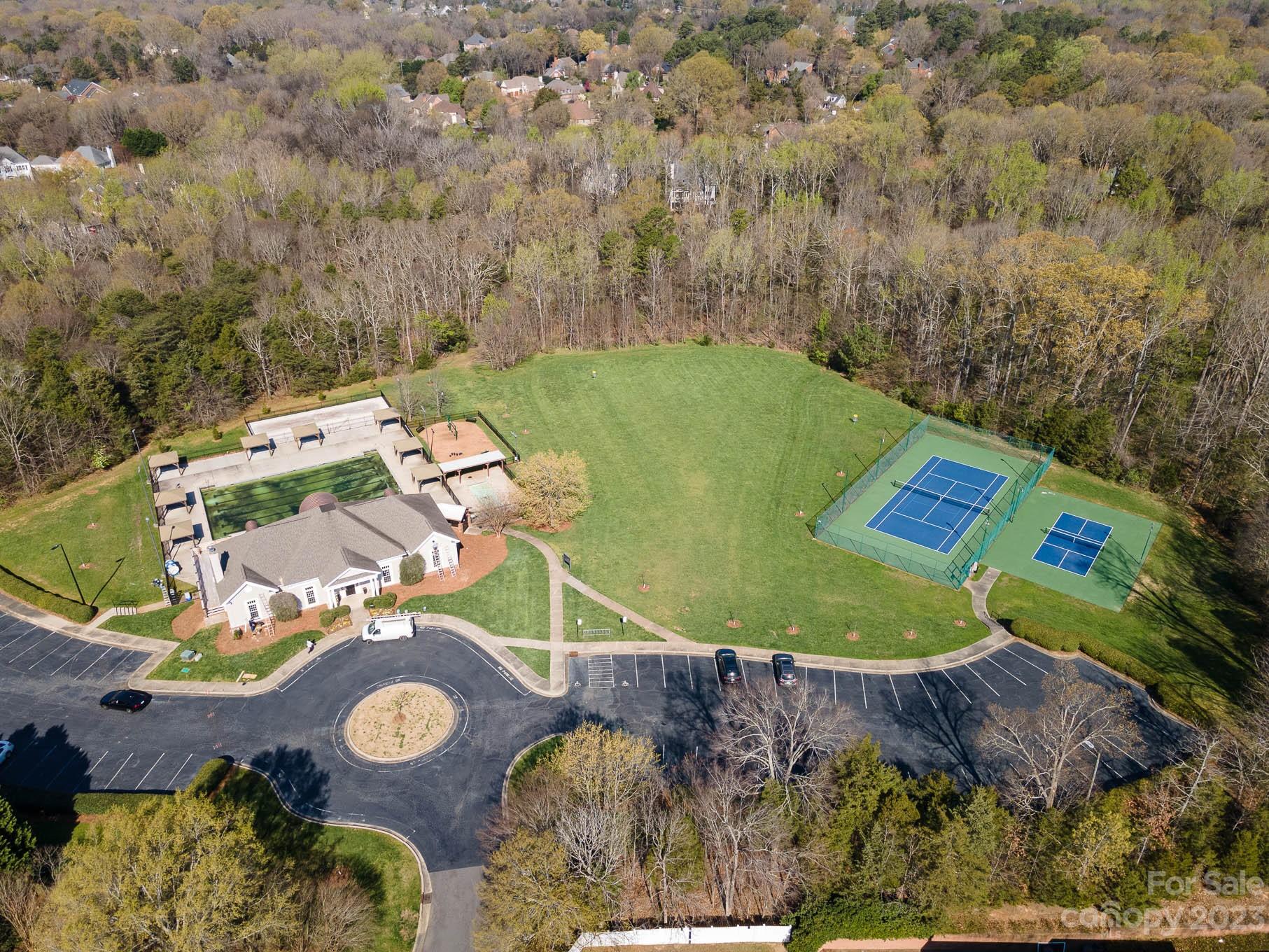 2906 Saintfield Place Charlotte, NC 28270 - Photo 34 of 37 an aerial view of a house with a swimming pool