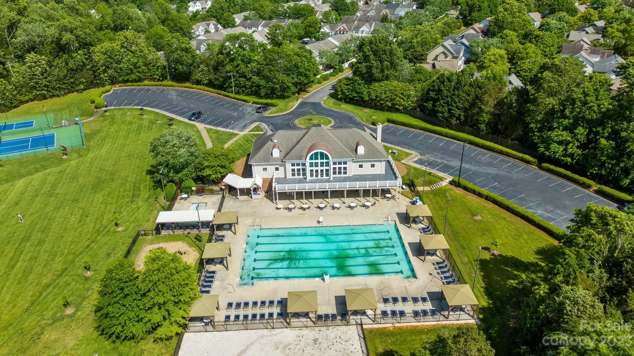 2906 Saintfield Place Charlotte, NC 28270 - Photo 36 of 37 a view of a swimming pool with a garden and plants