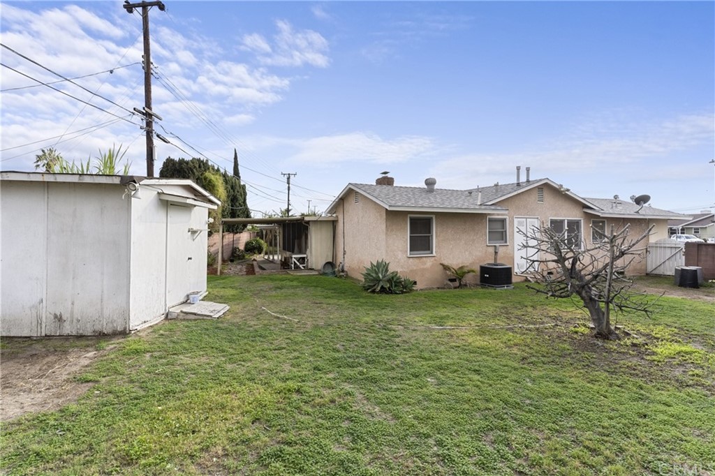 12042 Hackamore Road Garden Grove, CA 92840 - Photo 18 of 20 a view of a house with a yard