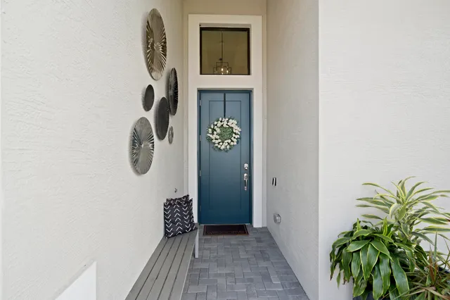 a living room with fireplace furniture and a large window