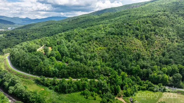 a view of a garden with a building
