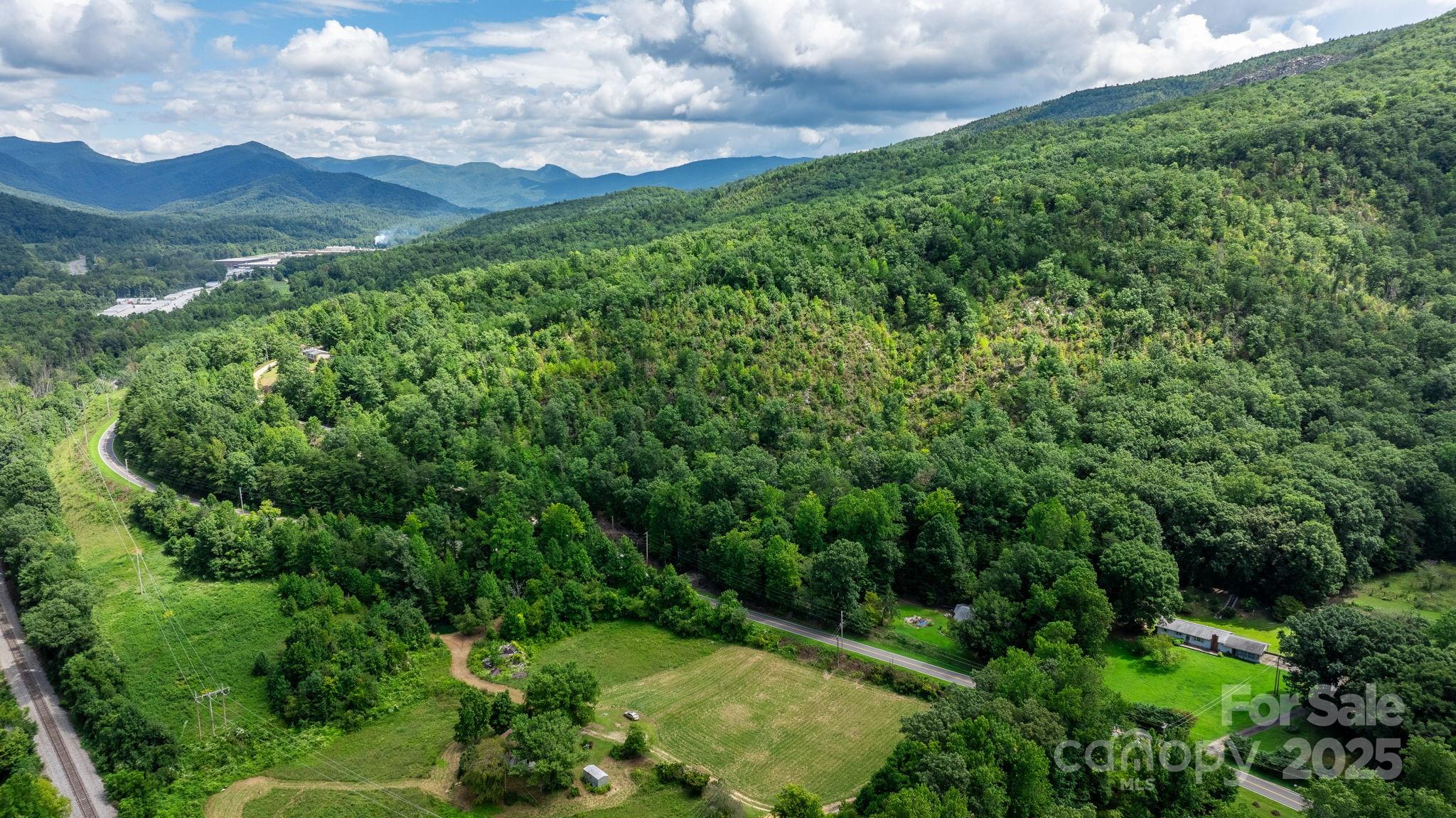 Tbd Old Linville Road Marion, NC 28752 - Photo 23 of 29 a view of a lush green forest with houses