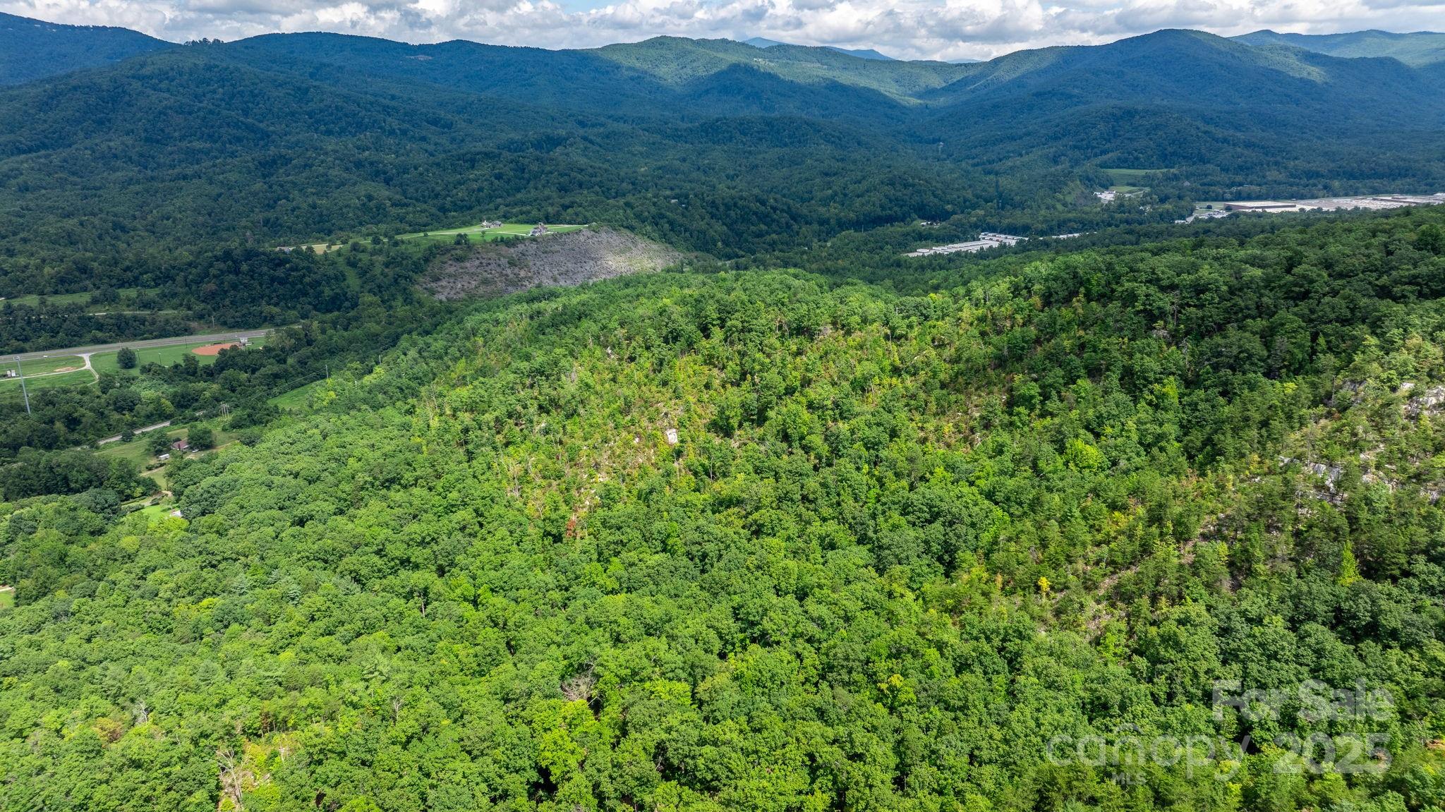 Tbd Old Linville Road Marion, NC 28752 - Photo 8 of 29 a view of a lush green hillside and a houses