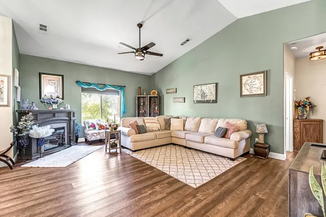 a living room with furniture or couch and a wooden floor