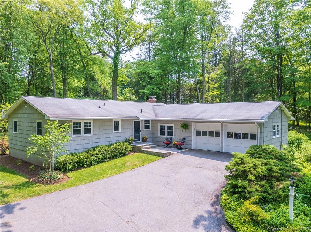 424 Branchville Road Ridgefield, CT 06877 - Photo 1 of 1 a house view with a garden space