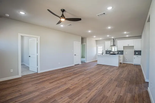 a view of kitchen with wooden floor and window