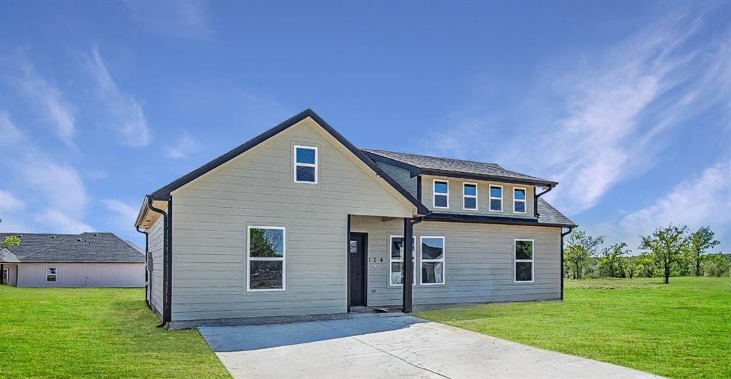 124 Brookview Drive Jacksboro, TX 76458 - Photo 2 of 34 a front view of house with yard and green space