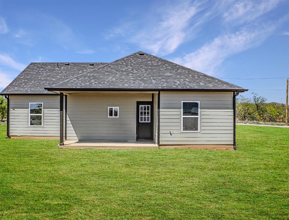 124 Brookview Drive Jacksboro, TX 76458 - Photo 33 of 34 a house with huge green field in front of it