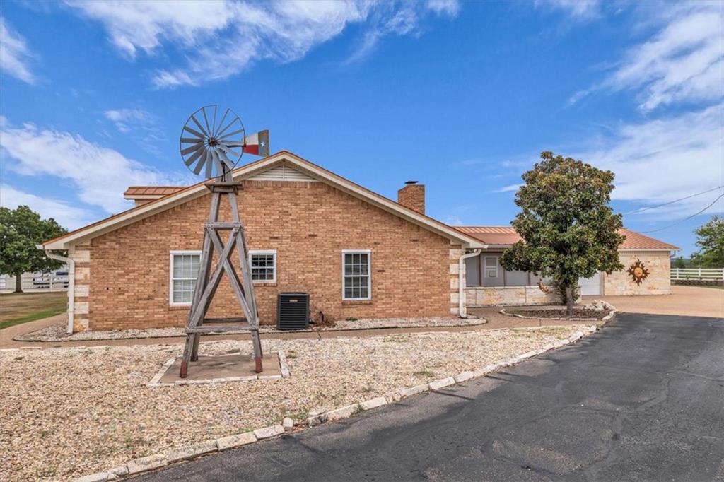 1064 Warren Road Lorena, TX 76655 - Photo 13 of 34 a house with trees in front of it