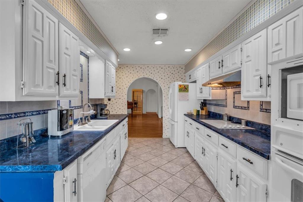 1064 Warren Road Lorena, TX 76655 - Photo 18 of 34 a large kitchen with stainless steel appliances granite countertop a lot of counter space and a sink