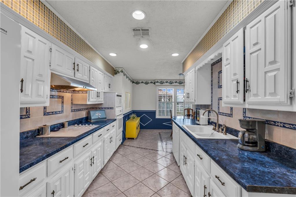 1064 Warren Road Lorena, TX 76655 - Photo 19 of 34 a large kitchen with stainless steel appliances granite countertop a lot of counter space