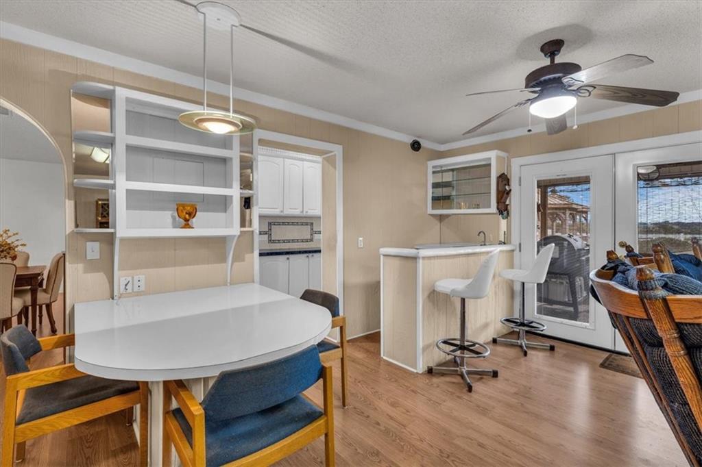 1064 Warren Road Lorena, TX 76655 - Photo 22 of 34 a view of a livingroom with furniture a ceiling fan and wooden floor