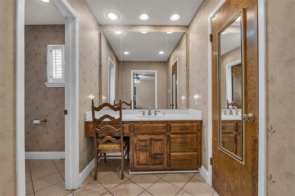 1064 Warren Road Lorena, TX 76655 - Photo 27 of 34 a bathroom with a sink and a mirror
