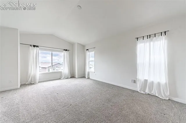 a bathroom with a glass shower door and a mirror