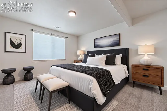 a bedroom with a bed and window