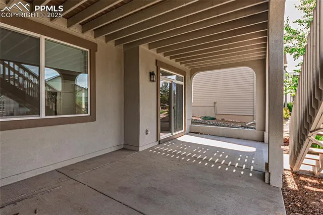 a roof deck with a yard and outdoor seating