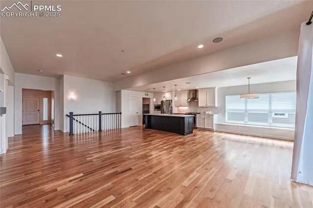 a view of kitchen and kitchen with a wooden floor