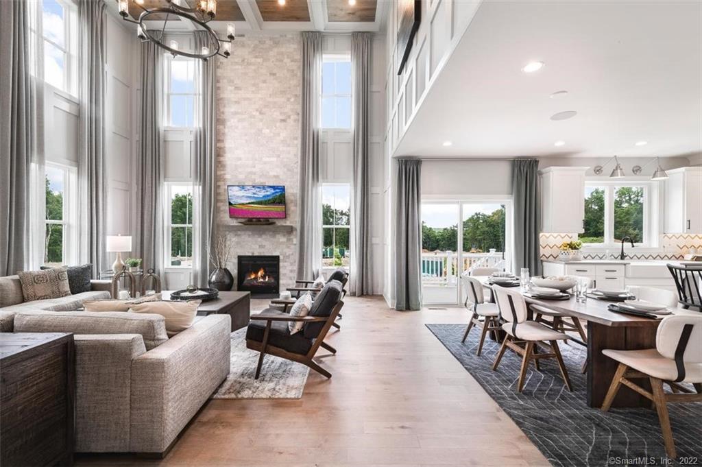 35 Enclave Drive, Unit 18 Trumbull, CT 06611 - Photo 1 of 1 a living room with fireplace furniture and a large window