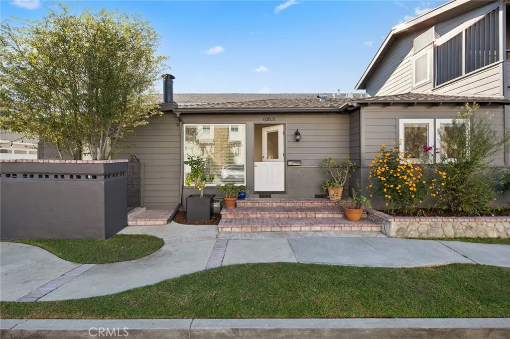 620 Acacia Avenue Corona del Mar, CA 92625 - Photo 1 of 24 a front view of a house with garden