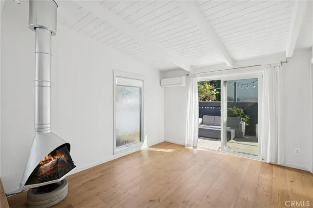 a view of a room with window and wooden floor