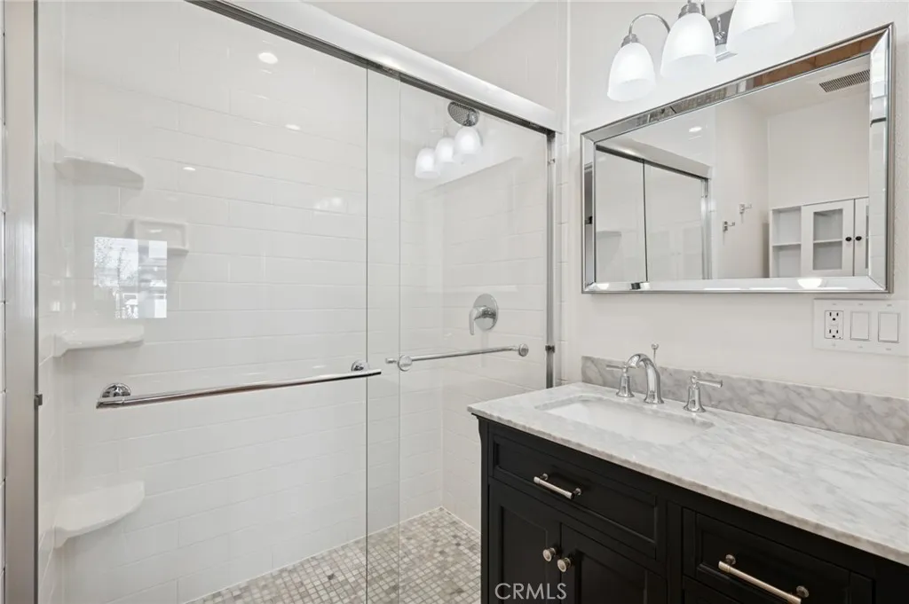 620 Acacia Avenue Corona del Mar, CA 92625 - Photo 15 of 24 a bathroom with a granite countertop sink mirror and double