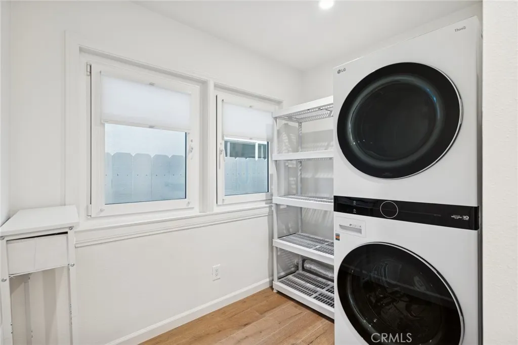 620 Acacia Avenue Corona del Mar, CA 92625 - Photo 17 of 24 a view of a hallway with washer and dryer