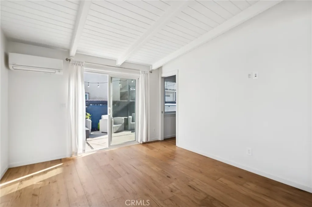 620 Acacia Avenue Corona del Mar, CA 92625 - Photo 10 of 24 an empty room with wooden floor and door