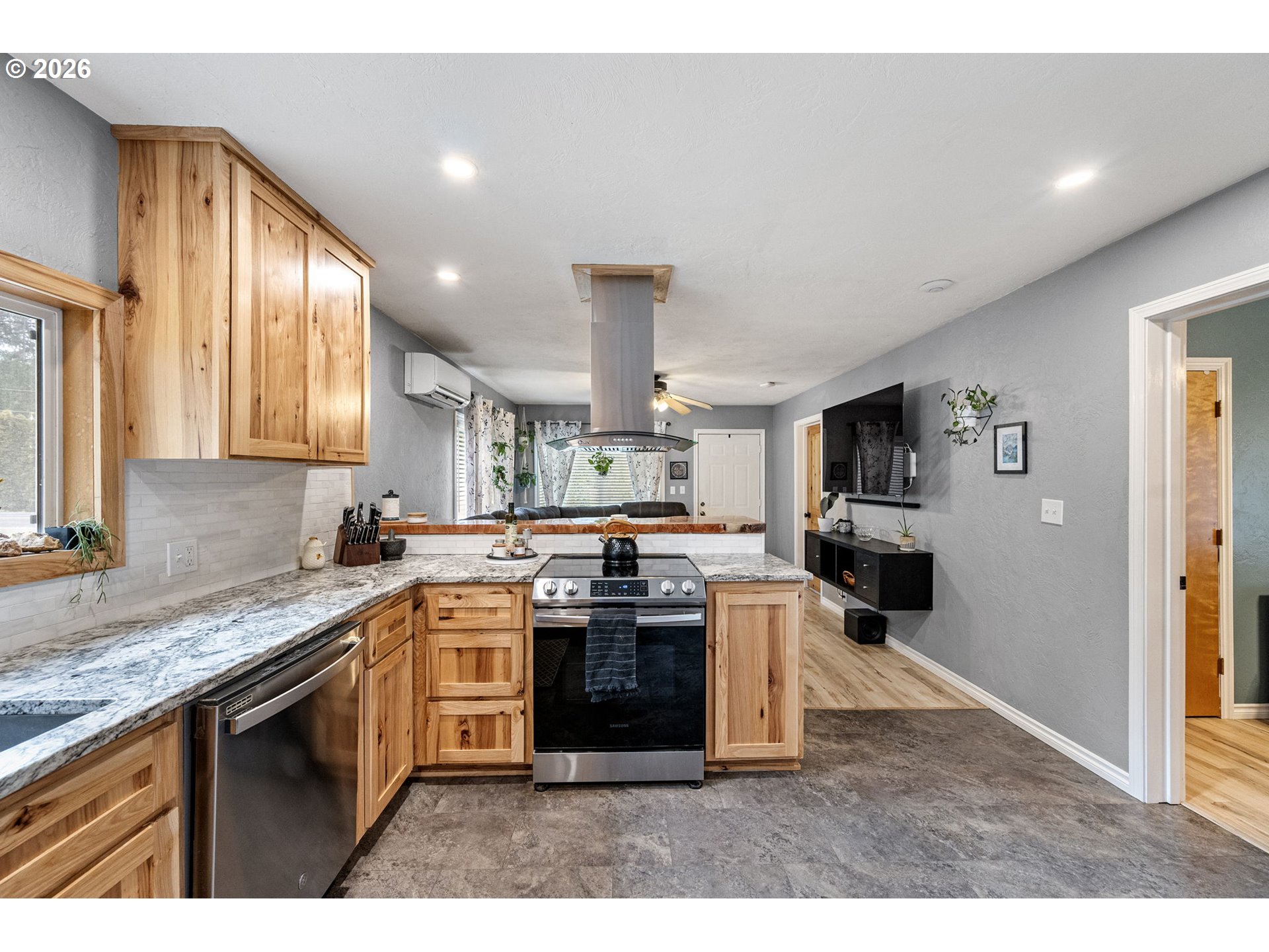 74129 London Road Cottage Grove, OR 97424 - Photo 12 of 44 a kitchen with stainless steel appliances granite countertop a stove sink and cabinets