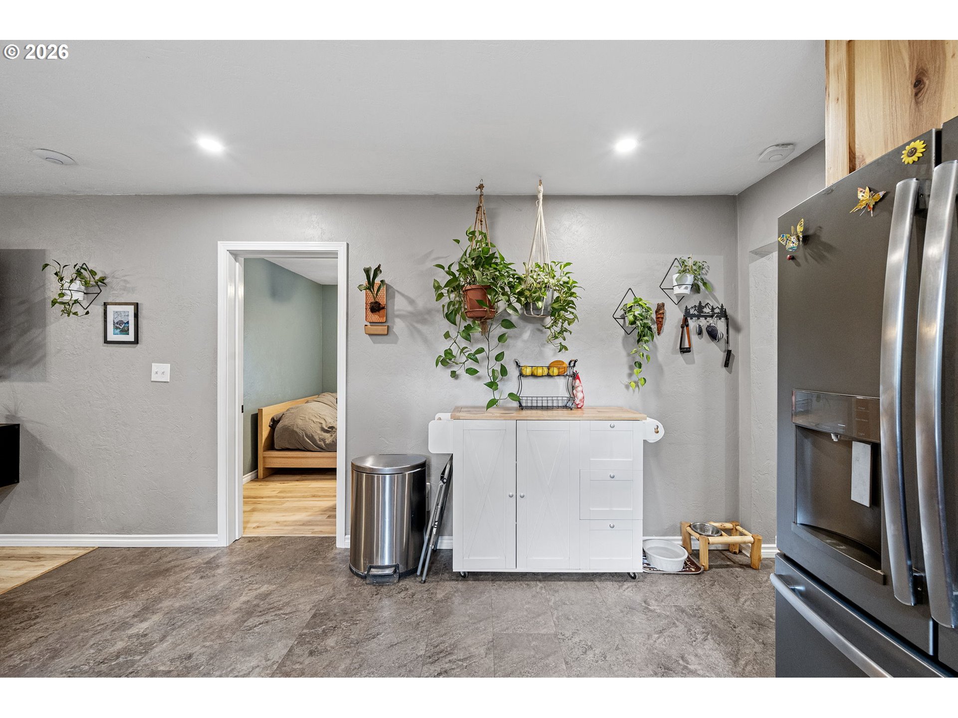 74129 London Road Cottage Grove, OR 97424 - Photo 13 of 44 a kitchen with stainless steel appliances kitchen island a refrigerator and a stove