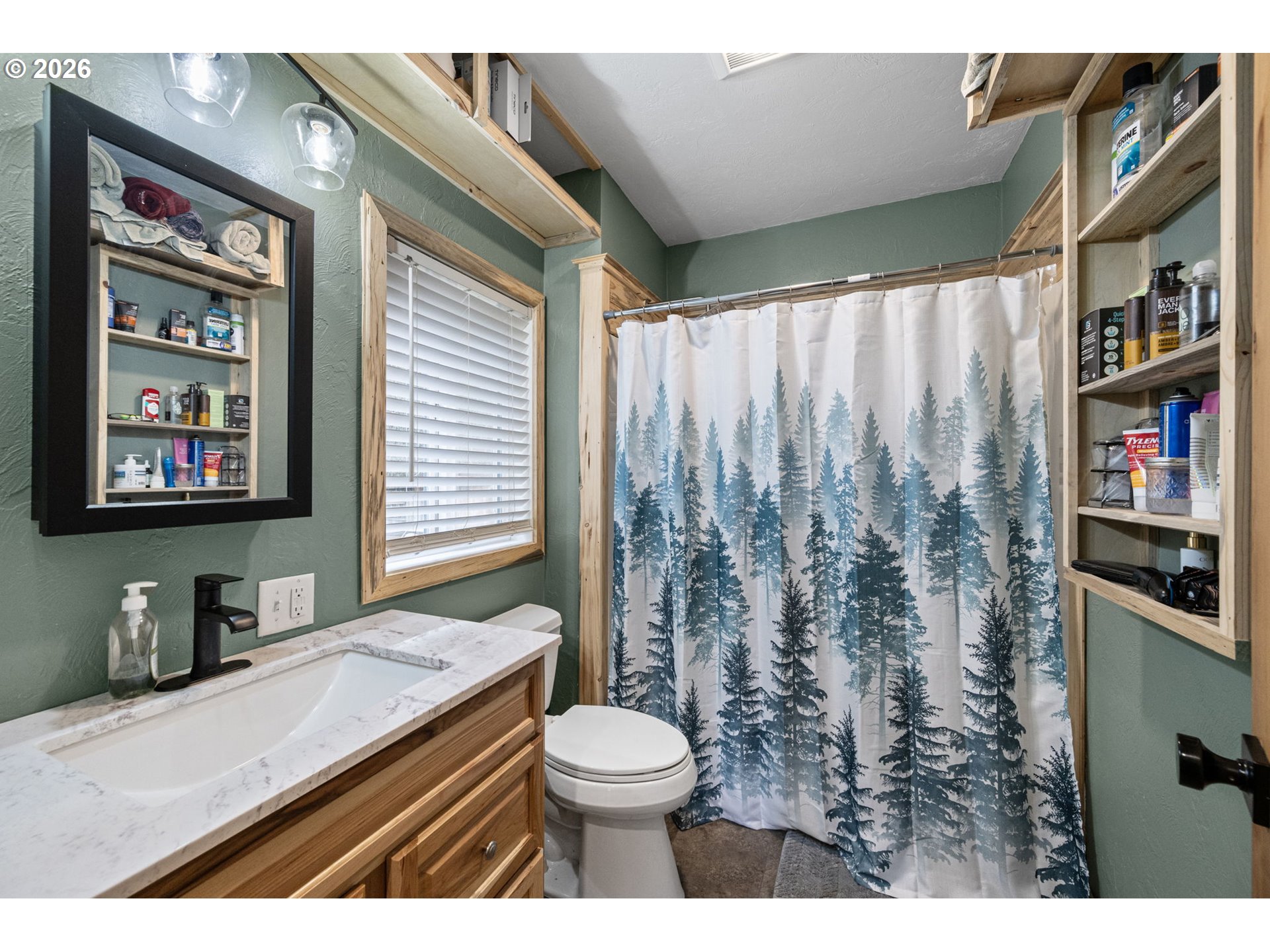 74129 London Road Cottage Grove, OR 97424 - Photo 17 of 44 a bathroom with a granite countertop sink mirror vanity and toilet