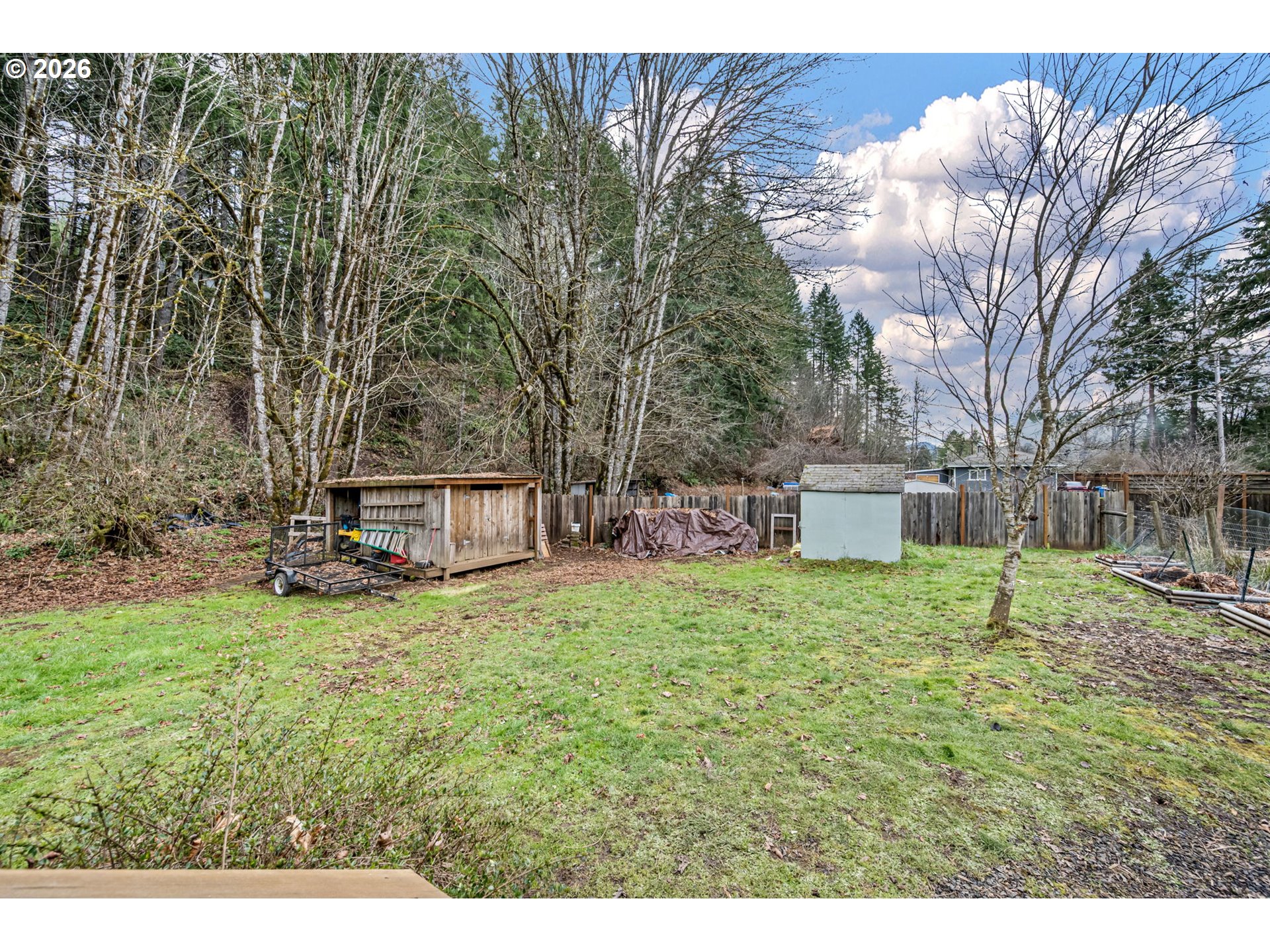 74129 London Road Cottage Grove, OR 97424 - Photo 20 of 44 a backyard of a house with table and chairs