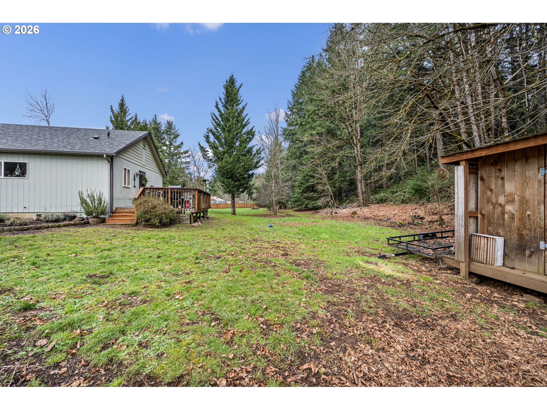 74129 London Road Cottage Grove, OR 97424 - Photo 22 of 44 a view of a backyard with a garden and entertaining space