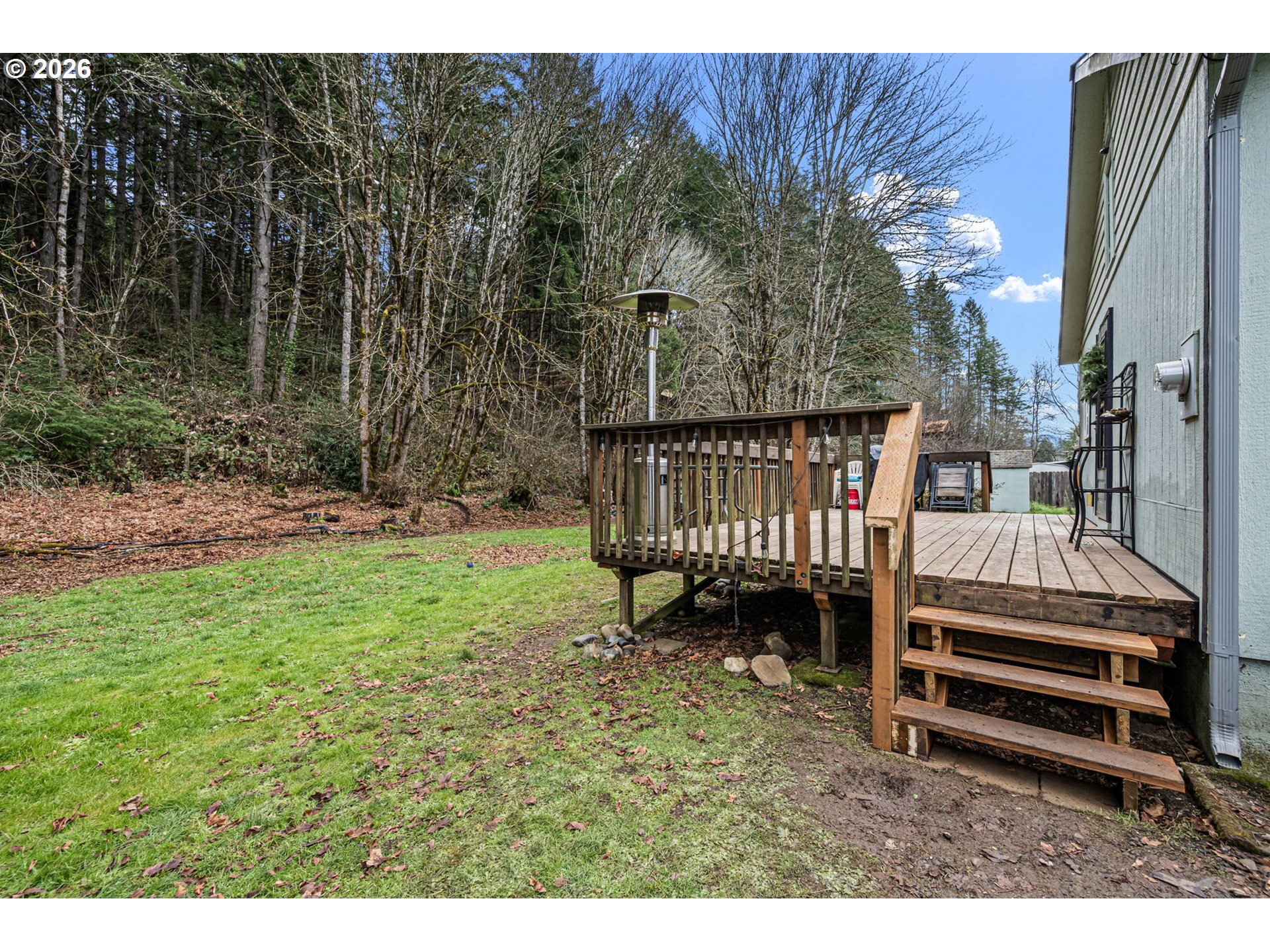 74129 London Road Cottage Grove, OR 97424 - Photo 25 of 44 a view of a backyard with a small cabin
