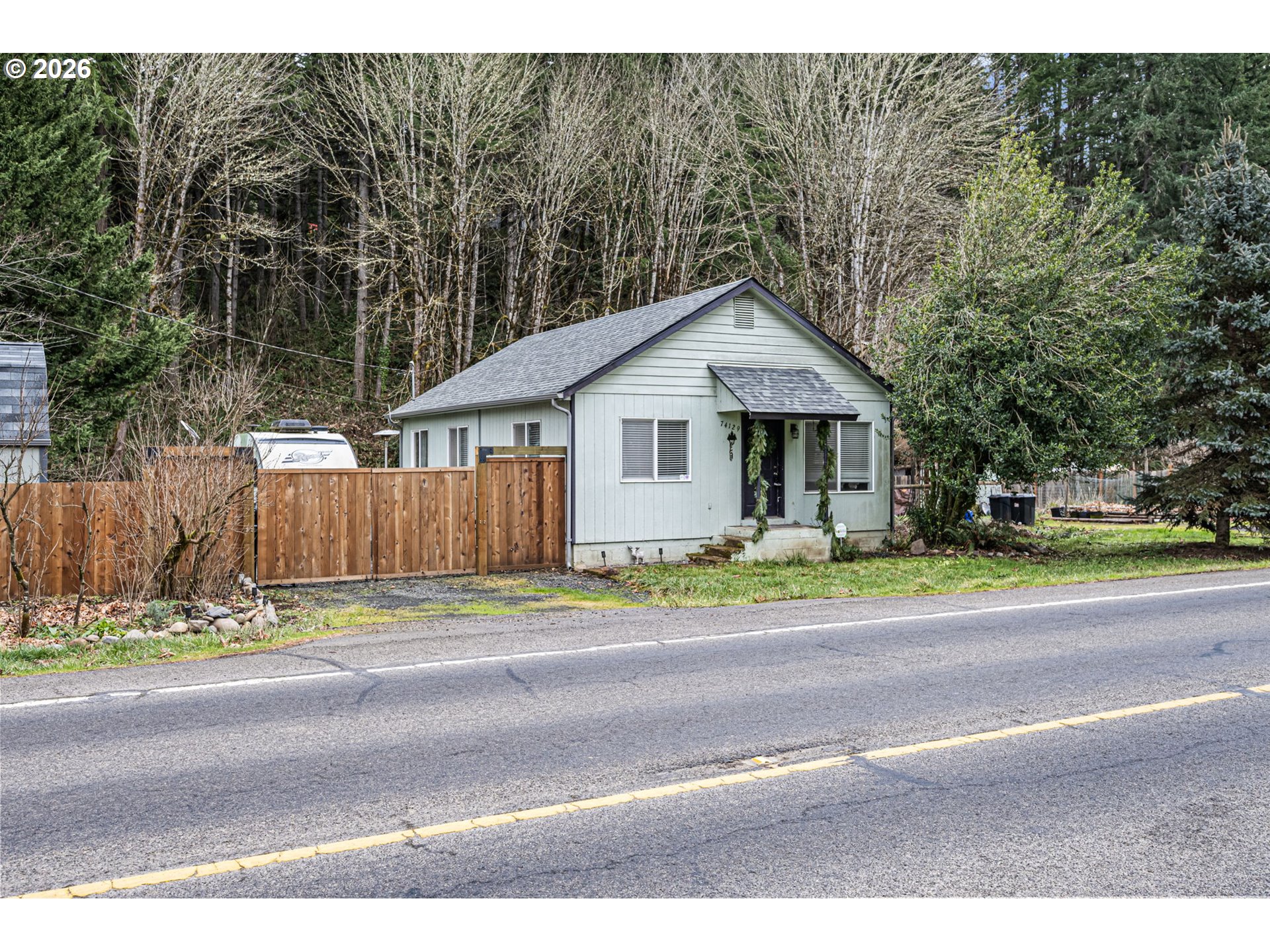 74129 London Road Cottage Grove, OR 97424 - Photo 3 of 44 a front view of a house with a garden and pathway
