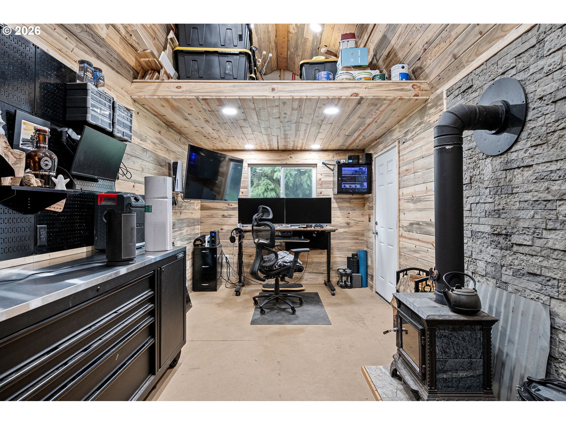 74129 London Road Cottage Grove, OR 97424 - Photo 31 of 44 a kitchen with stainless steel appliances kitchen island granite countertop a stove and a microwave
