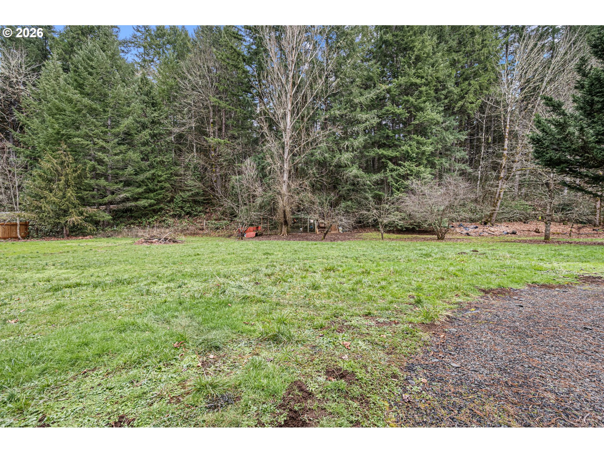 74129 London Road Cottage Grove, OR 97424 - Photo 32 of 44 a view of a field with trees in the background