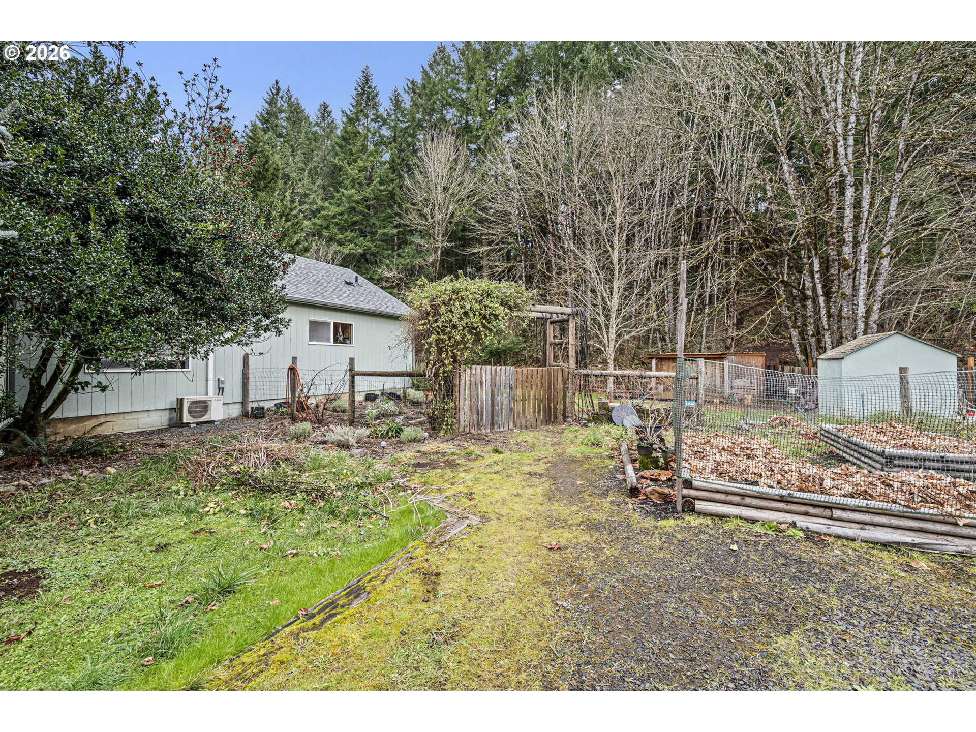 74129 London Road Cottage Grove, OR 97424 - Photo 43 of 44 a backyard of a house with table and chairs