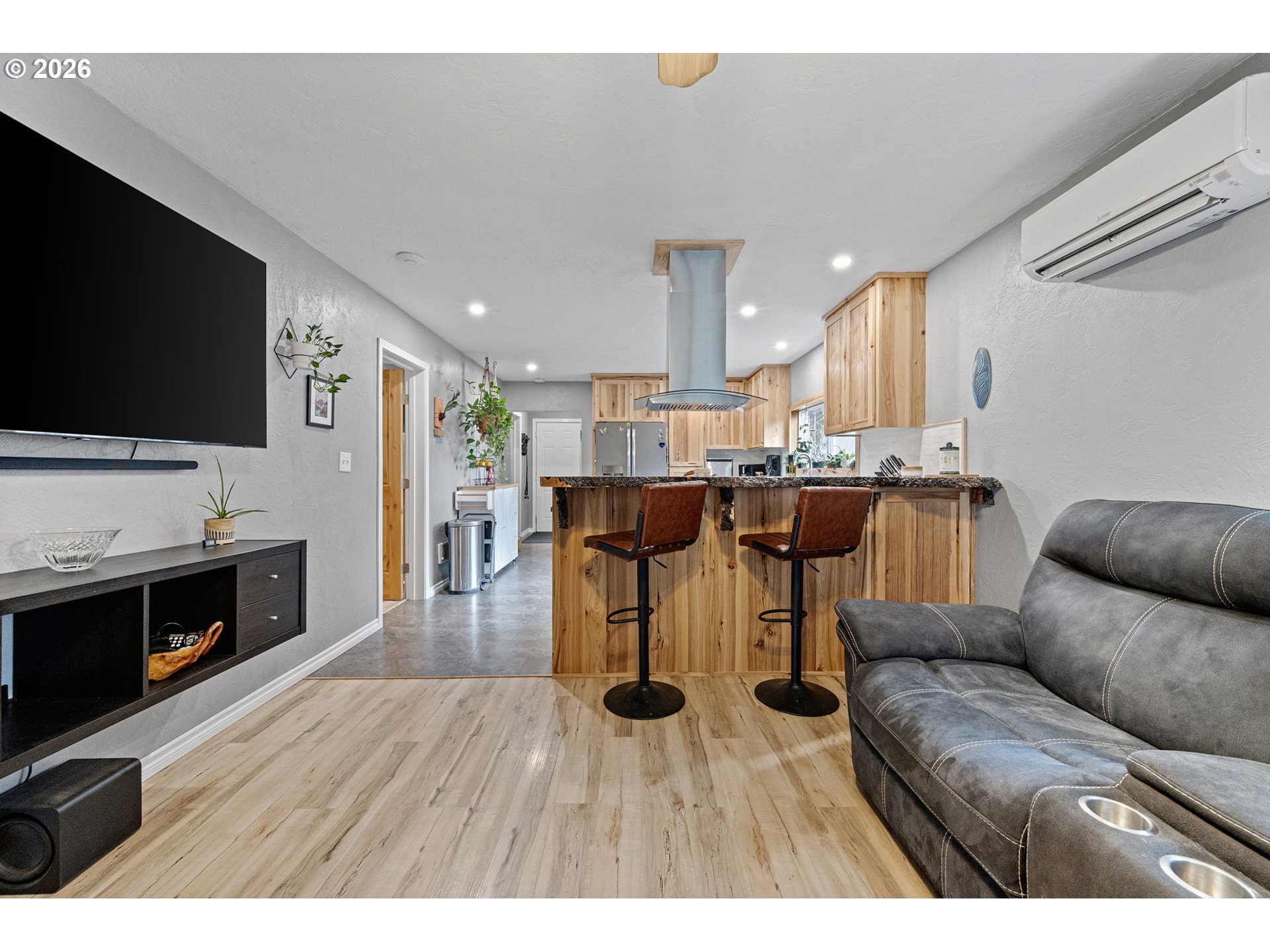 74129 London Road Cottage Grove, OR 97424 - Photo 6 of 44 a living room with stainless steel appliances furniture and a flat screen tv