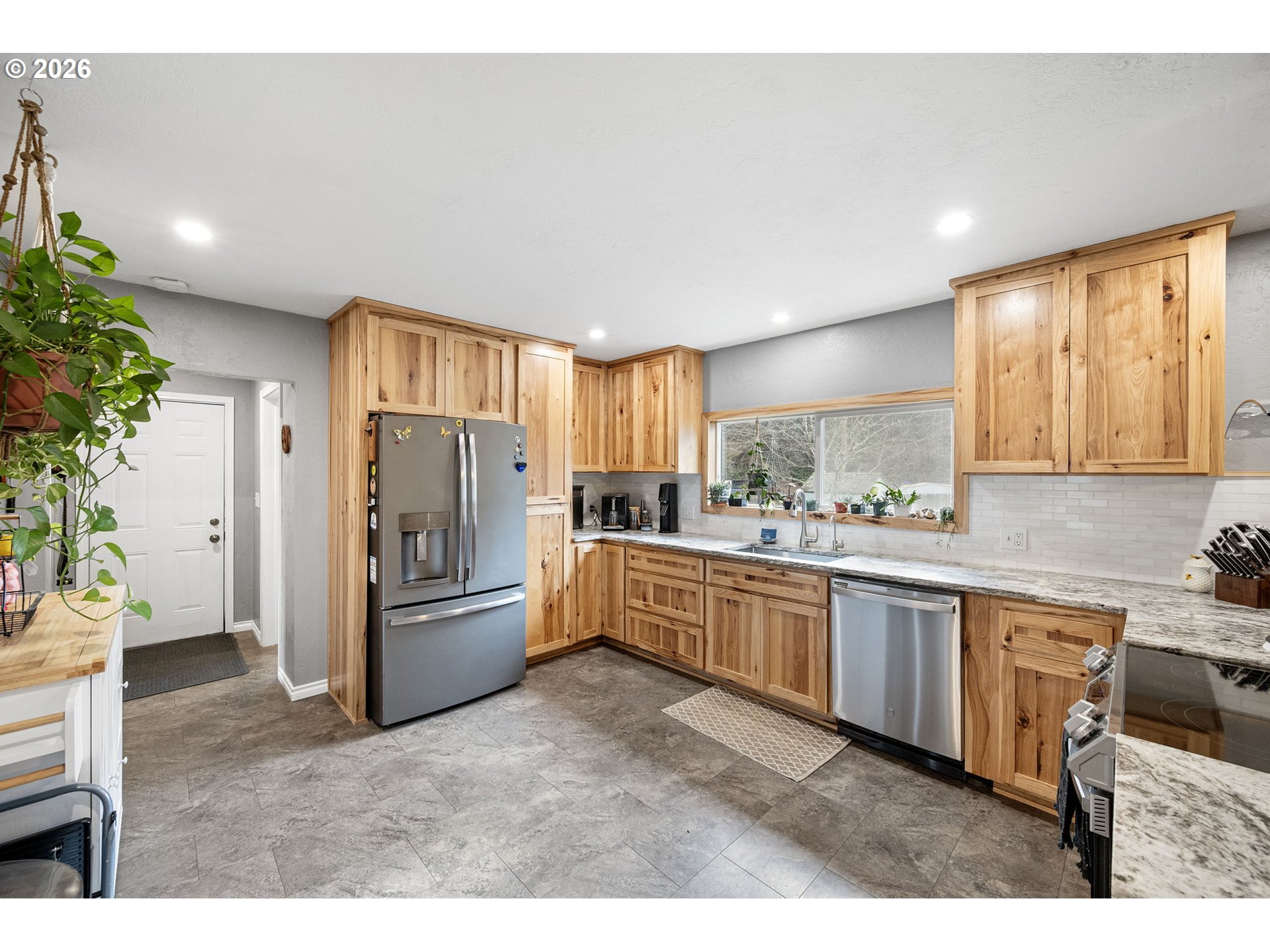74129 London Road Cottage Grove, OR 97424 - Photo 9 of 44 a kitchen with refrigerator and cabinets