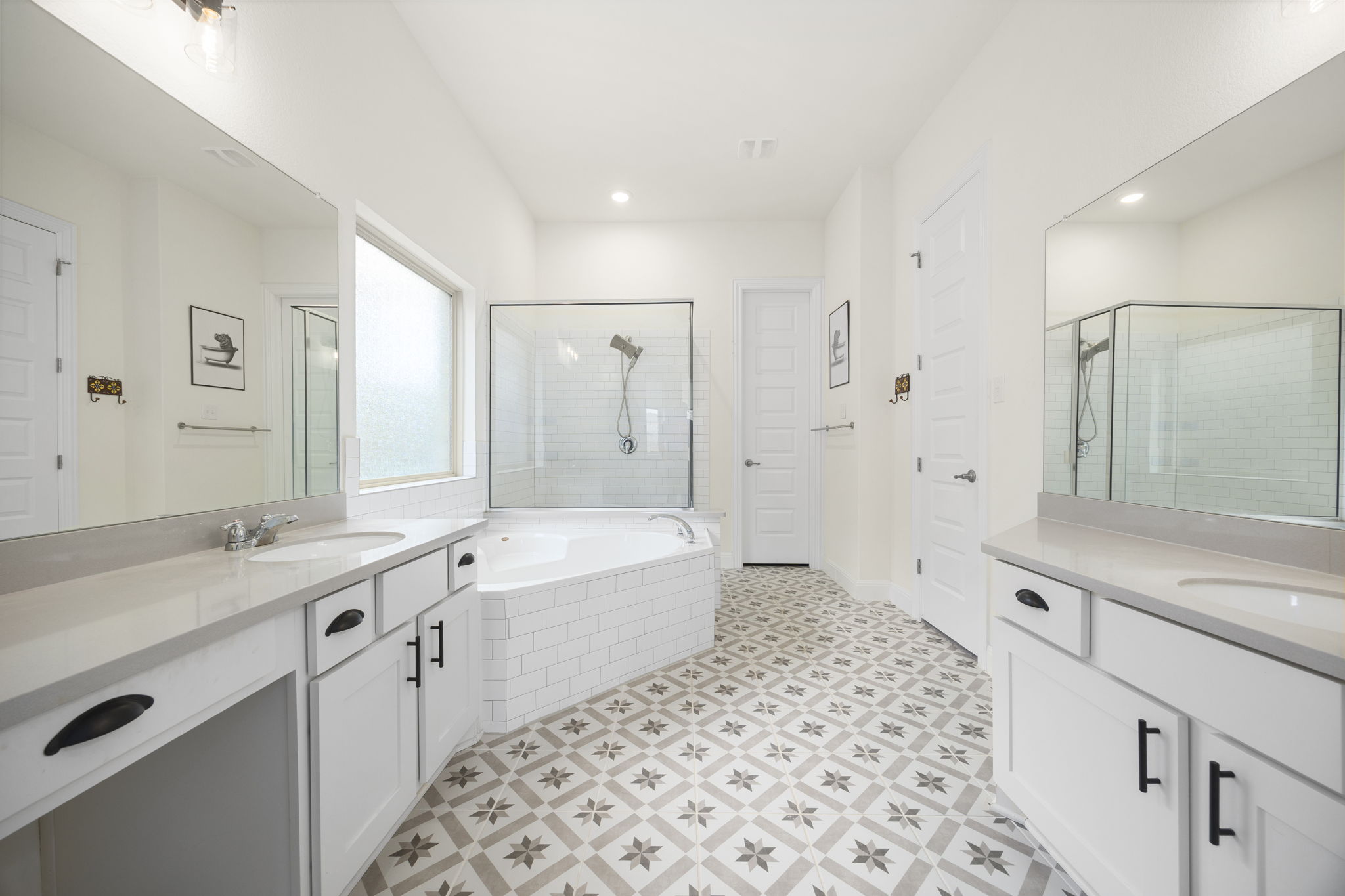 1098 Cherrystone Loop Buda, TX 78610 - Photo 17 of 37 a bathroom with a bathtub shower sink and a mirror